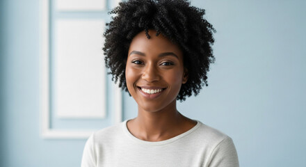 A portrait of a smiling african american woman with curly hair, exuding confidence and positivity