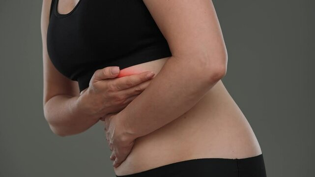 Woman Experiencing Abdominal Pain