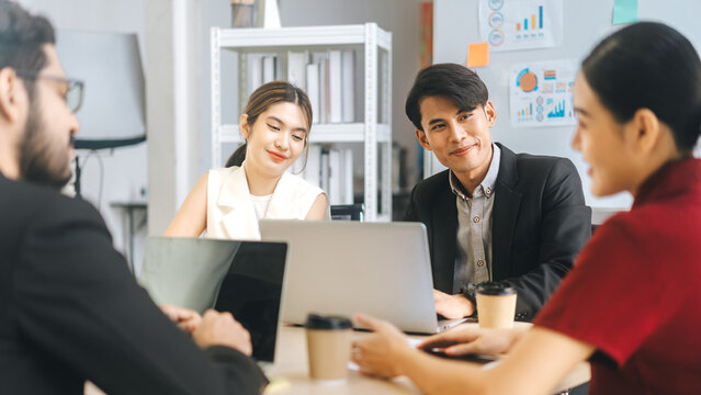 Business culture asian man woman gen y and gen z team working together in office