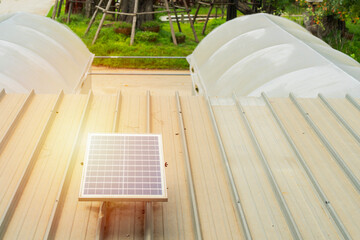 Mini solar cell panel installed on the roof near the plant nursery in agriculture farm.