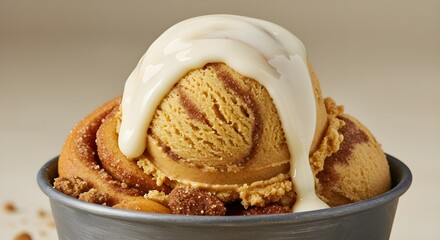 A scoop of cinnamon bun ice cream with icing swirl.