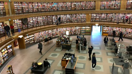 City library panorama timelapse captures vibrant activity and visitors engaging with books and resources throughout the day
