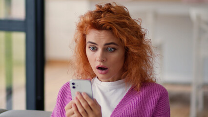 Caucasian woman lady user female girl at home couch indoor looking at mobile phone smartphone bad...