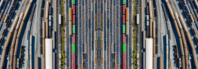 Symmetrical aerial view of colorful containers at Bang Sue station in Bangkok, showing industrial...