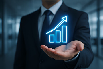 Business growth represented by a chart on a businessman's hand.