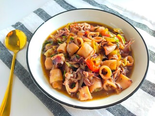 tumis cumi or oseng cumi or stir fried squid, traditional cuisine from Indonesia