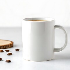 A white mug filled with coffee next to a wooden coaster and scattered coffee beans on a white surface