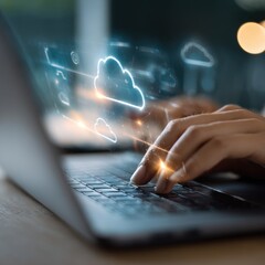 Hands typing on laptop with cloud icons