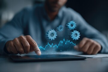 Man interacts with tablet showing gears and graph