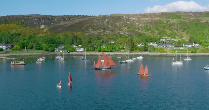 Drone captures Ullapool Lugger Fest with luggers cruising Loch Broom in the Highlands