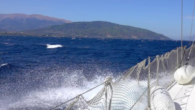 Sailing Yacht and Water Splashes. Slow Motion