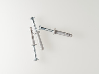 Screws with dowels on a white background