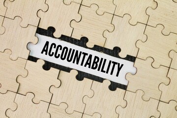 Wooden puzzle with the word ACCOUNTABILITY. concept of responsibility. responsibility for one's actions and decisions and being accountable for their outcomes
