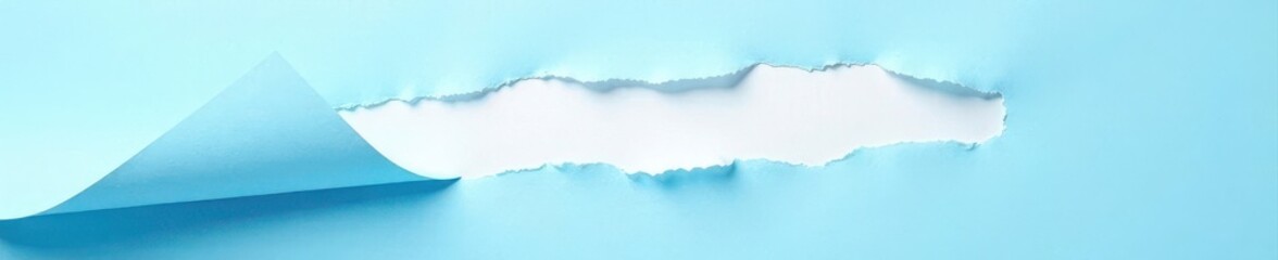 Close-up of ripped light blue sheet, revealing white underlayer, rip, closeup, fragment