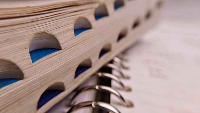 Closeup of a Tabbed Binder with Metal Rings Selective Focus.