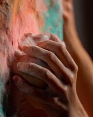 Woman’s Hand Gripping Indoor Climbing Hold