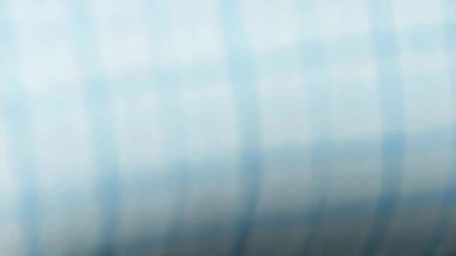 Light blue graph paper background creating a precise grid pattern