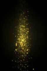 Obraz premium Golden particles cascading against a dark background.