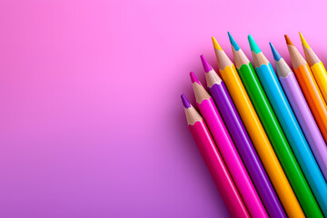 Row of colorful sharpened pencils arranged diagonally on pink purple gradient background. Creative education concept for back to school, educational platforms and school ads, children's art products