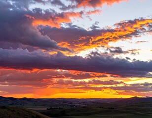 Dramatic sunset over rolling hills
