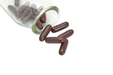 Pile of pills in a bottle on transparent background