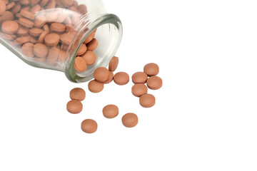 Pile of pills in a bottle on transparent background