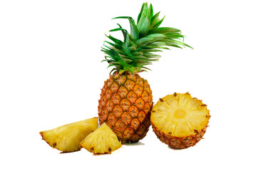 Pineapple with half and slices isolated on a white background