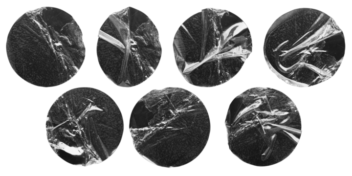 transparent adhesive round plastic sticker label set isolated on black background