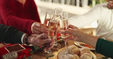 Champagne, cheers and hands of people with christmas celebration, party or gathering in home. Happy, toast and family in dining room with sparkling wine for xmas event in festive season at house. - Powered by Adobe