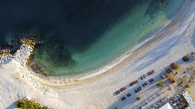 Aerial view of the coastline, where the turquoise sea meets the sandy shore near Å½njan beach, Split, Split-Dalmatia County, Croatia. - Powered by Adobe