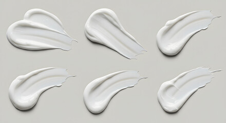Set of White Cream Swirls on Gray Background