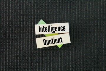 Colored paper with the word Intelligence Quotient. total score derived from a set of standardized...