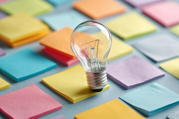 Idea Concept With Bulb and Paper Notes