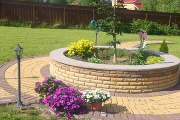 flowerbed and flowers on a summer cottage, roses and landscape design, 2