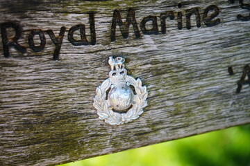 Solomon’s Temple, Buxton, England - July 8 2025: Royal Marines emblem displayed on a weathered...