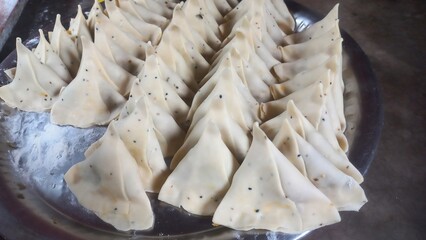 Raw Samosa ready to be fried  famous Indian snack food,How to make crispy and flaky samosa,A very...