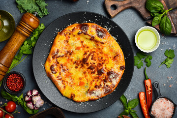 Traditional Georgian khachapuri mingrelian with cheese and caviar. Georgian cheese pie.