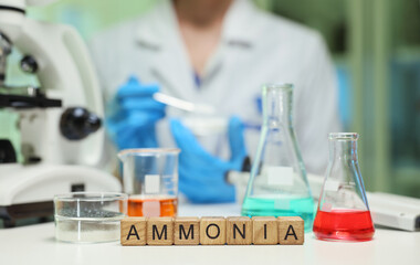 A dedicated scientist enthusiastically conducts an intricate experiment involving ammonia in a...