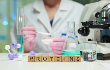 A skilled technician analyzes proteins using advanced tools and techniques in a research laboratory