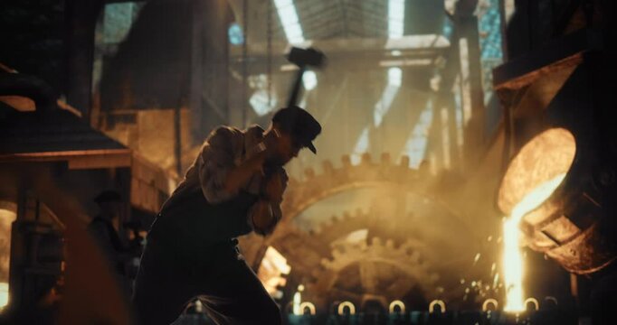 Industrial-Age Male Laborer Grips a Sledgehammer with Both Hands, Delivering Powerful Blows Onto Metal. Surrounded by Coal Smoke and Glowing Molten Iron, Laborer Works with Grit and Determination