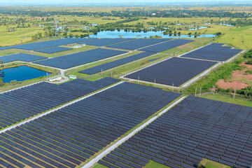Drone shot aerial view solar energy array provides renewable power in large scale facility...