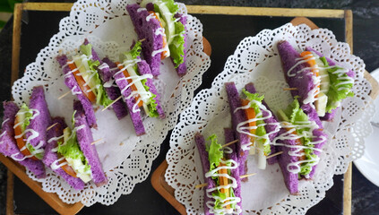 Deliciously vibrant purple sandwich, loaded with fresh, healthy ingredients. A visually appealing...