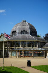 Pavilion Gardens, Buxton, England - July 8 2025: Victorian glass pavilion with domed roof and Union Jack flag. © The Nott'm Lass