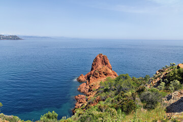 Steep coast on the Cote d'Azur, French Riviera, overlooking the open Mediterranean Sea with ships