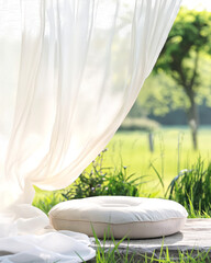 Cozy outdoor seating area, soft white cushions on a round surface, bright greenery in the background, perfect for relaxation.