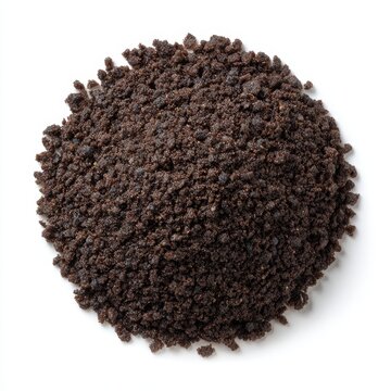 Pile of dark brown cookie crumbs or crushed oreos isolated on white background