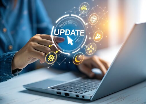 Person updating software on a laptop with a digital interface