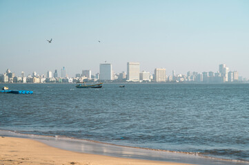 Juhu beach and skyline of Mumbai, India, travel destination in Asia, tropical west coast, Arabian Sea 