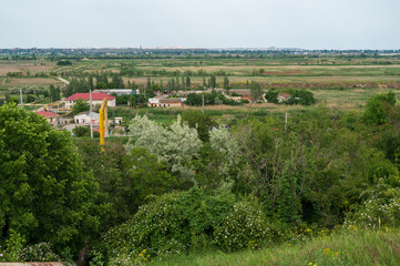Village in the valley, houses and infrastructure. Picturesque landscape of the countryside