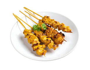 Grilled chicken satay on white plate